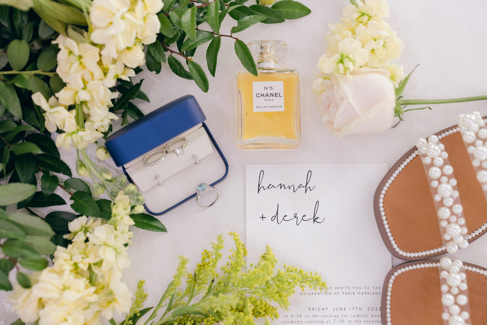 luxury wedding details for Kindred North wedding, including Blakeman's Fine Jewelry ring and earrings, chanel no 5 perfume, and greenery.