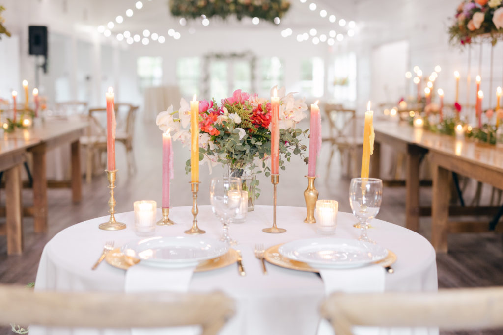 Luxe florals and candles at Kindred North wedding reception details.