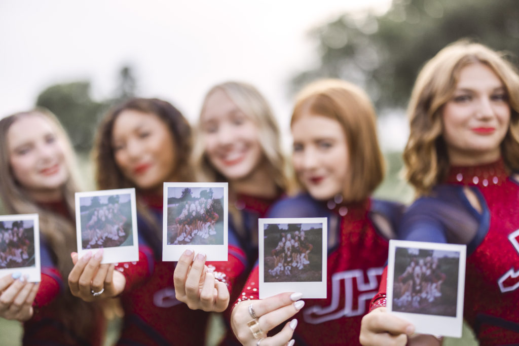 Dance Team Photographer shoots a lineup of girls holding polaroid photos