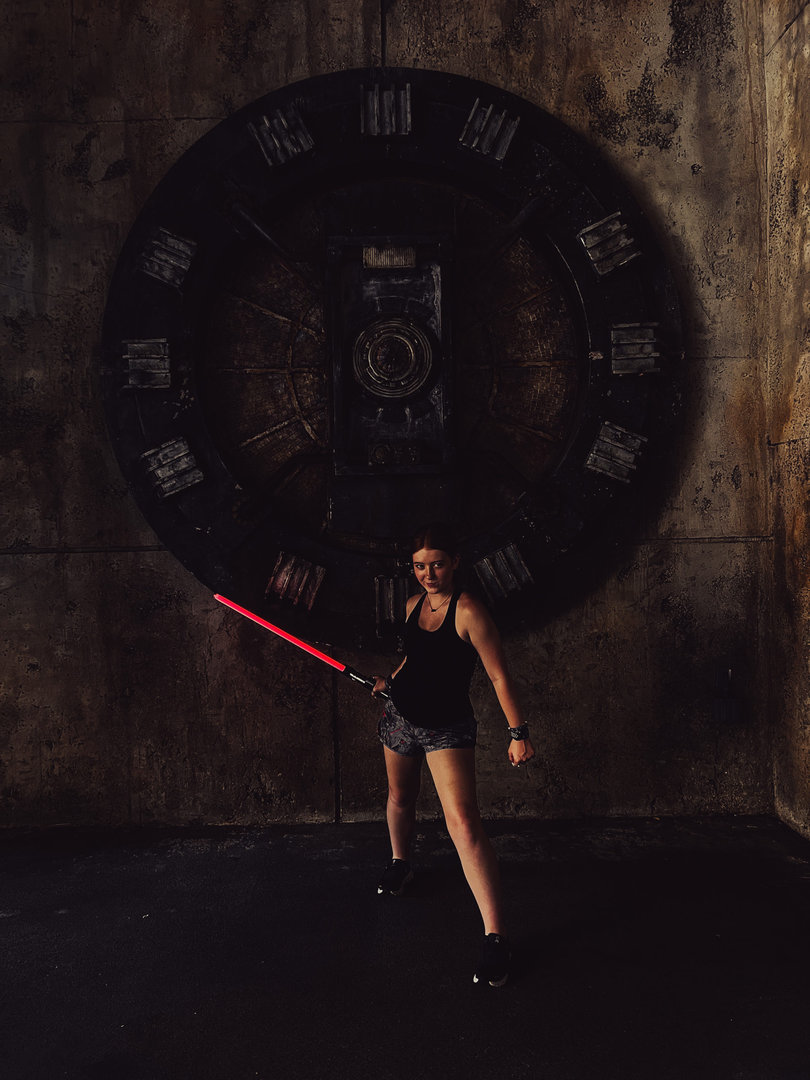 Ellie's Dark Side with a light saber from Disney World.