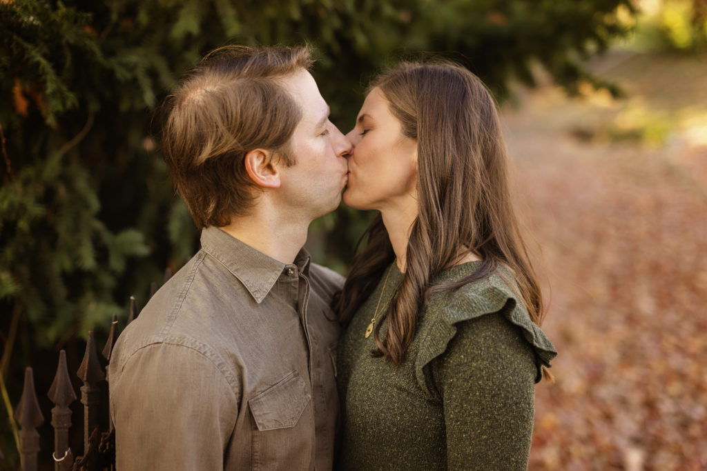 Fall Mini Session in NWA showing Anna Roblee and Carl George kissing