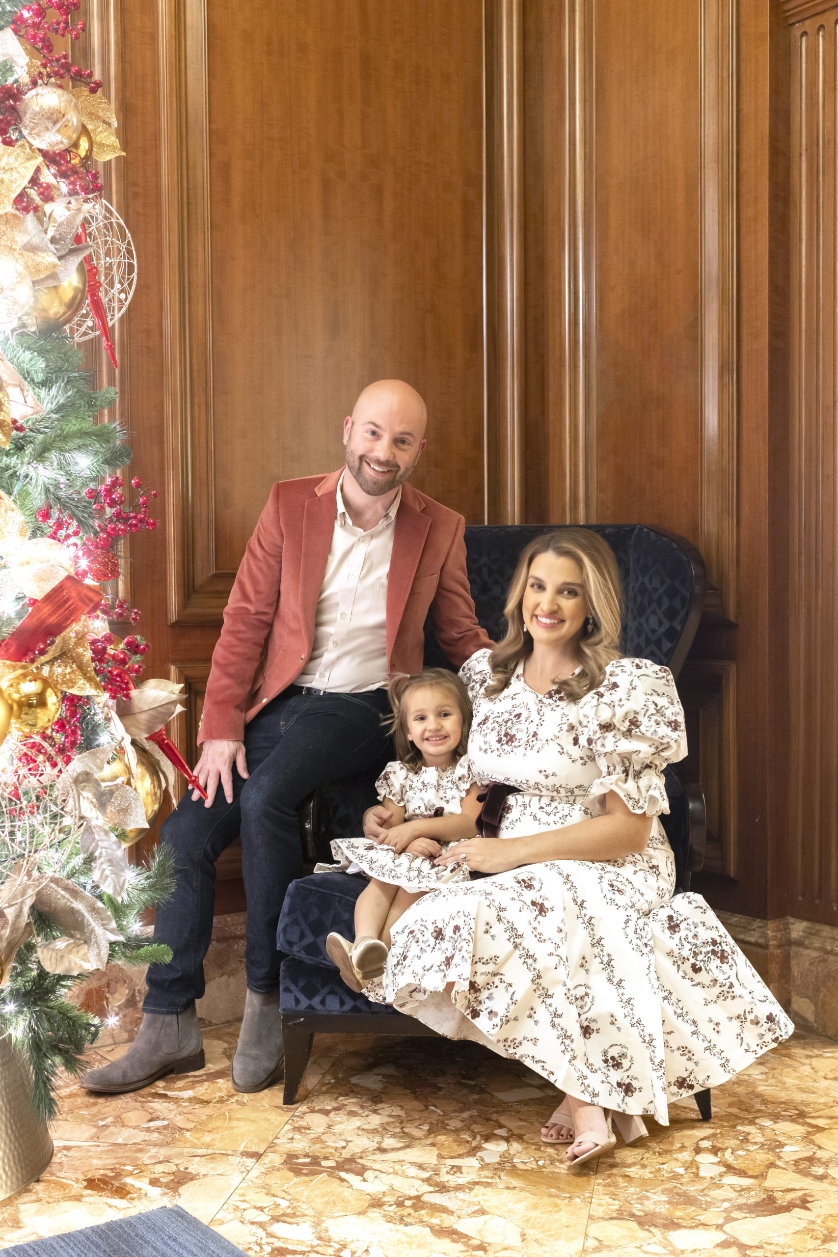 The Benfield family dressed up for Christmas with their family photos at the Ritz-Carlton