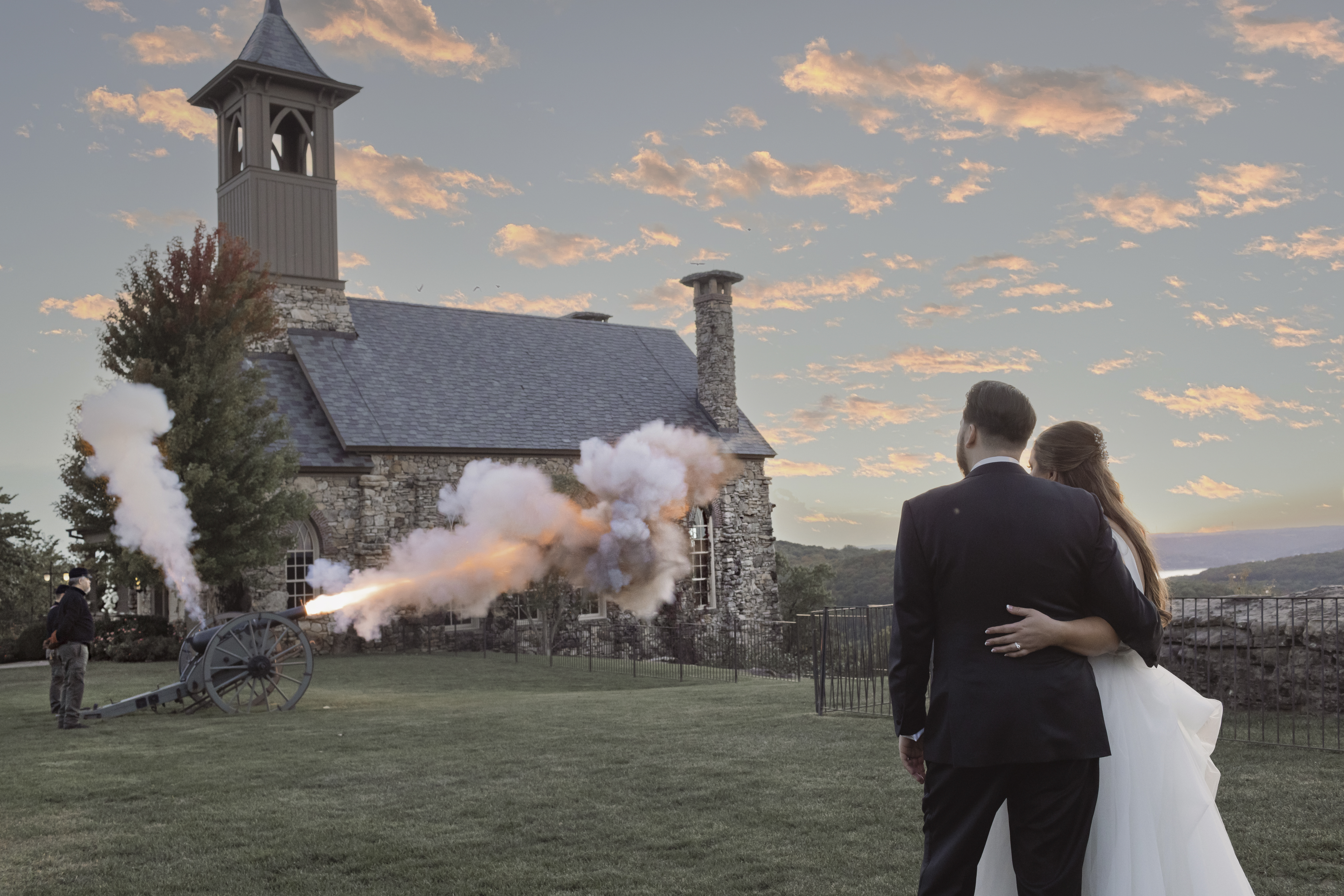 Luxury wedding photographer gets perfect shot of canon going off at a wedding at Top of the Rock at Big Cedar Lodge in Ridgedale Missouri near Branson.