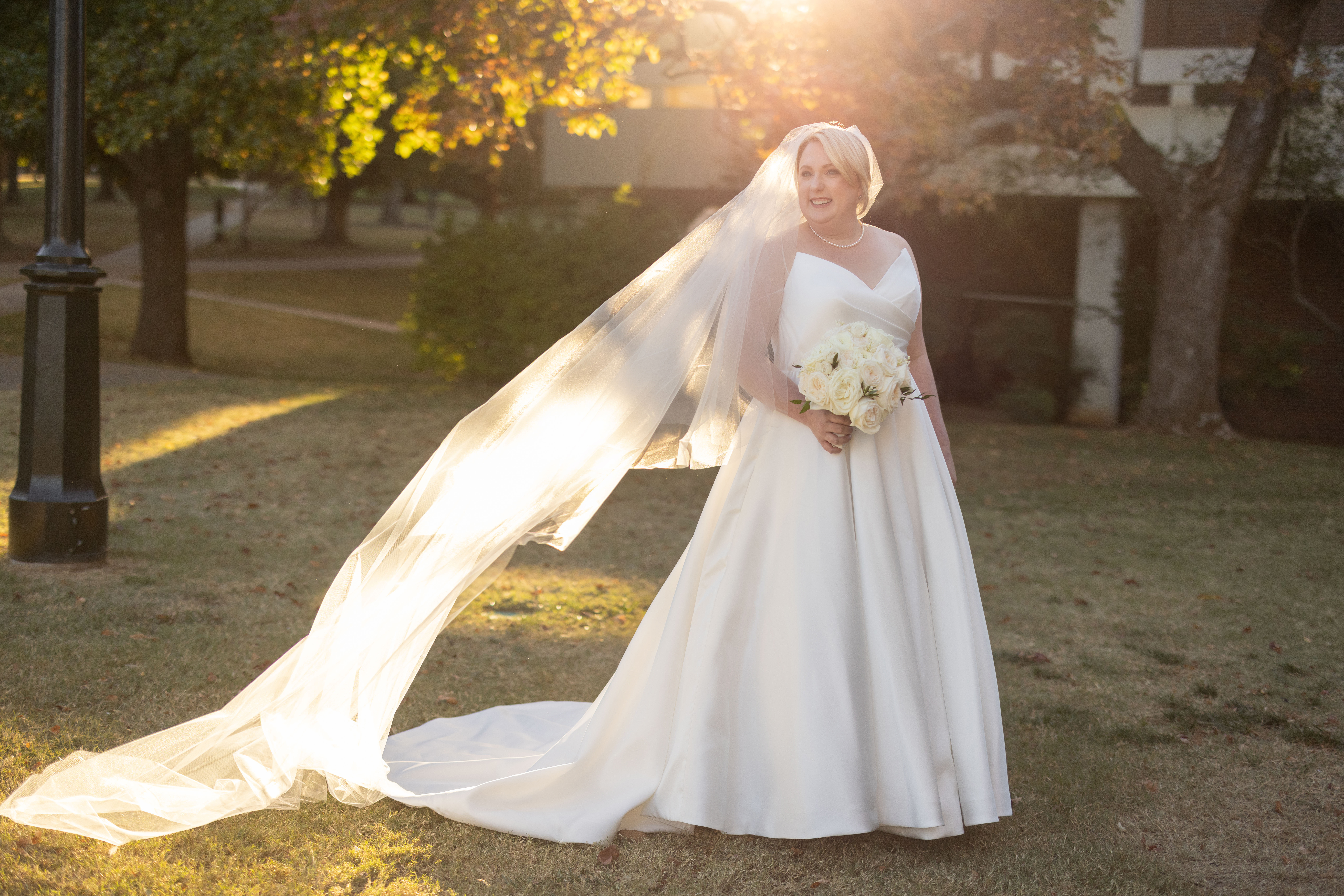 southern bride portraits at Carnall Hall in Fayetteville at golden hour