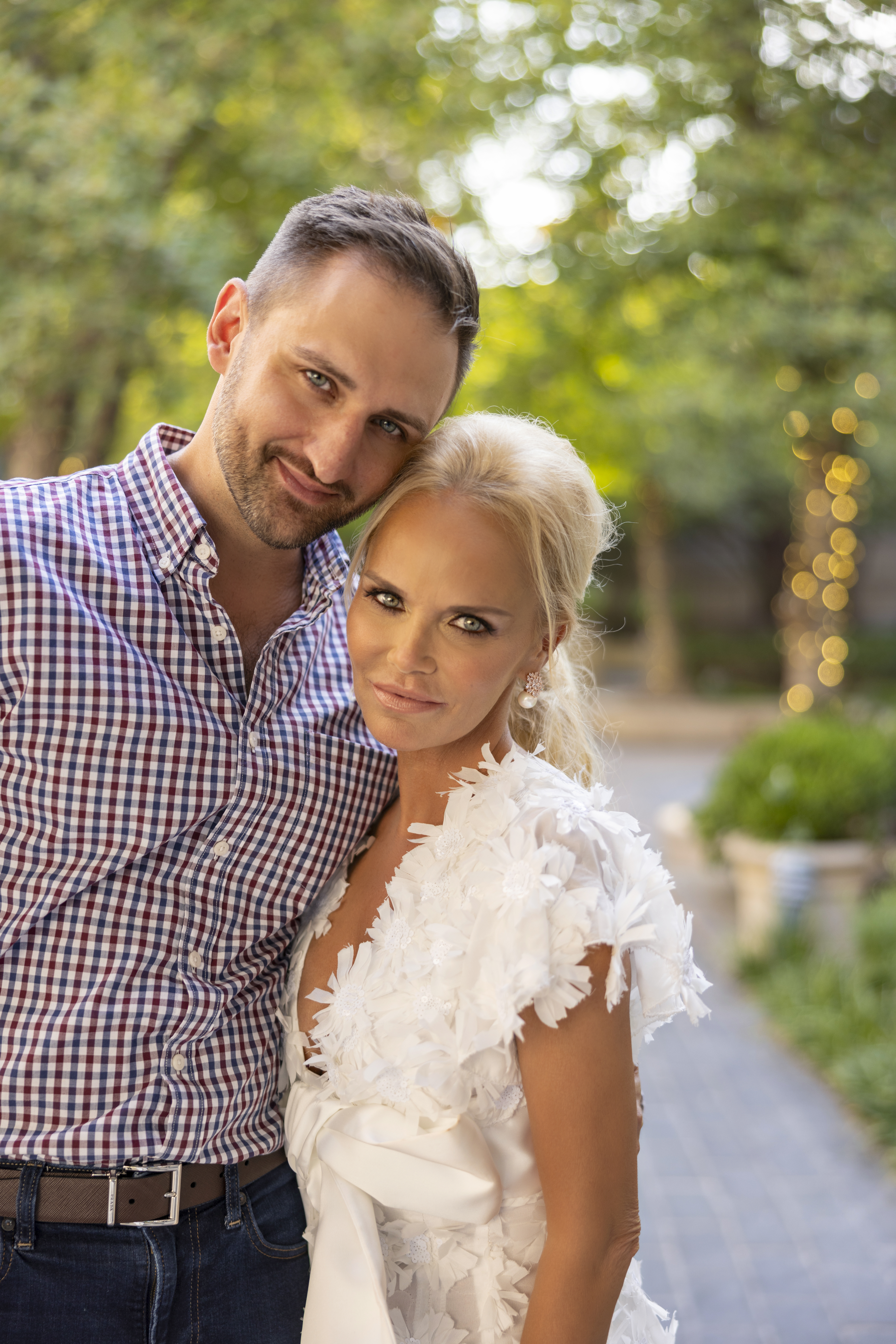 An engagement portrait for Josh Bryant and Kristin Chenoweth's rehearsal dinner outside during golden hour.