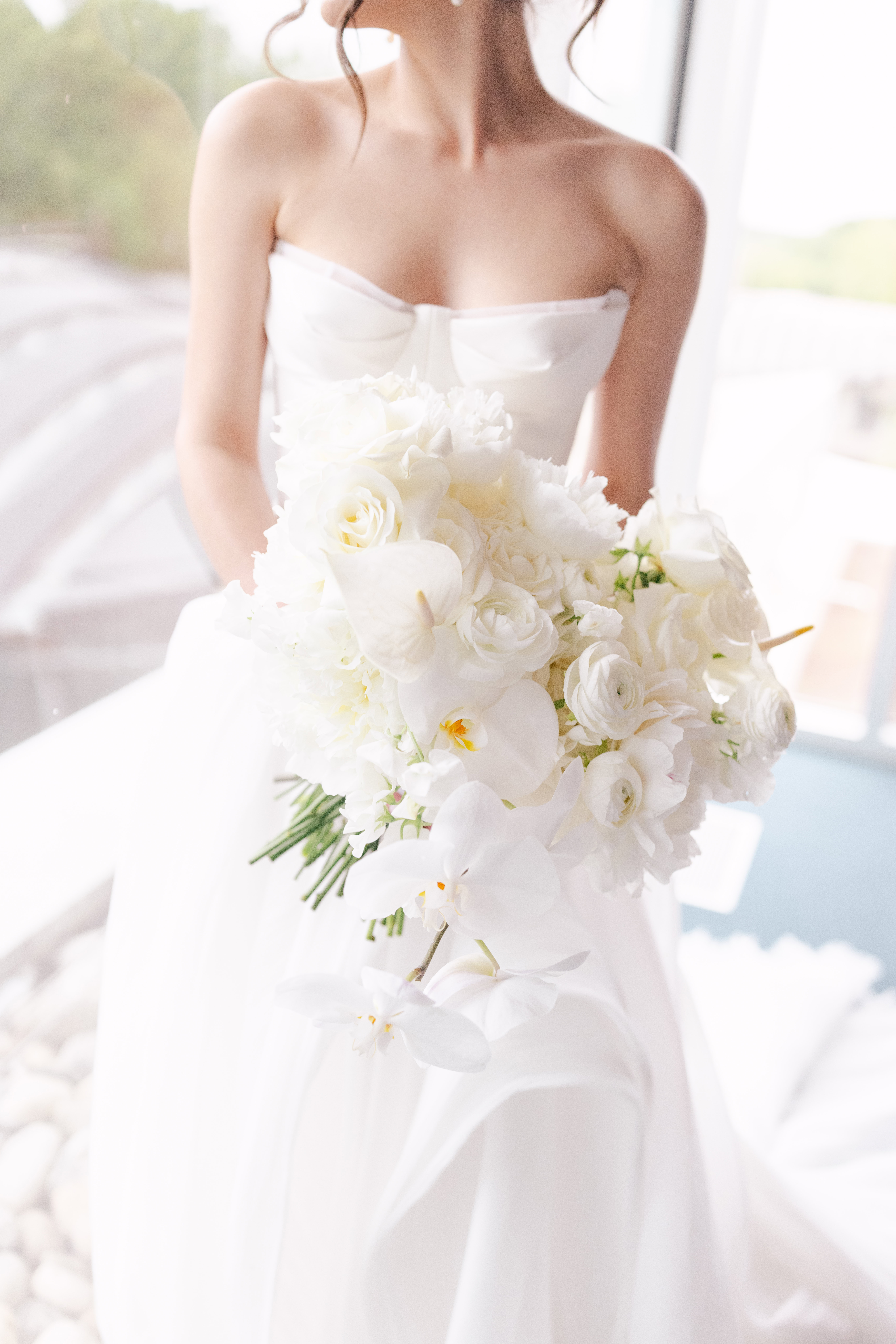 Teaser images of all white flowers for a bride at her Crystal Bridges wedding.