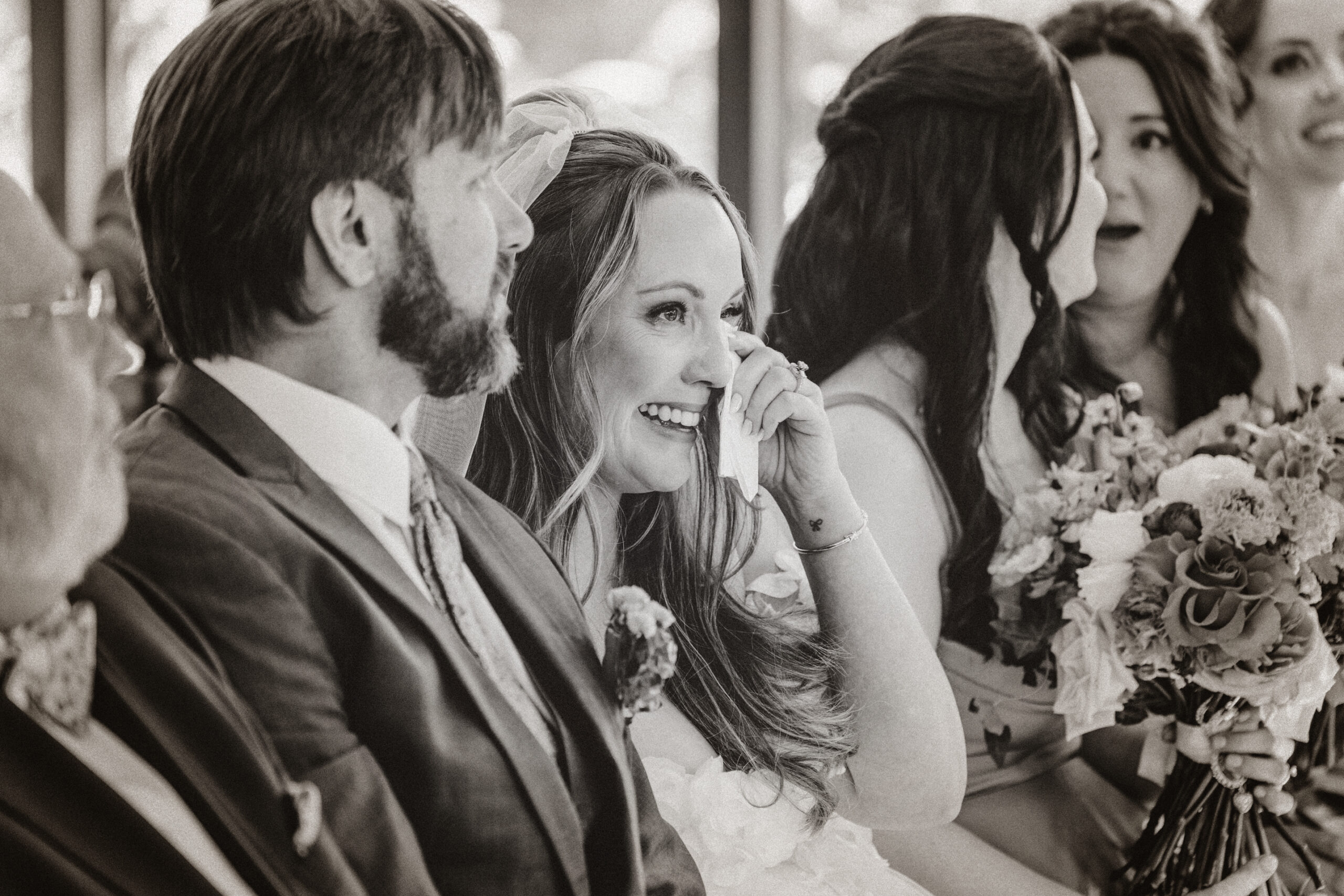 Bride emotional during ceremony at Compton Gardens wedding in Bentonville Arkansas